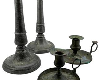 108 - Group Lot Vintage Pewter Candle Holders 9" (Description): Group lot of vintage pewter candle holders featuring a pair of tall columnar candlesticks with round stepped bases, and two chamber-style candlesticks with finger loops and drip trays. The collection displays an aged patina throughout. Tallest measures 9 inches.