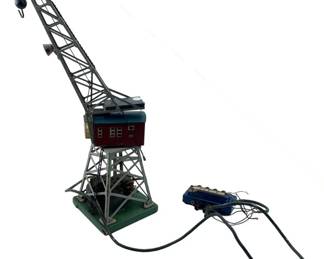 256 - Vtg Marklin HO Scale 7051 Electric Crane (Description): Vintage Marklin HO scale 7051 electric tinplate crane. This detailed model features a working crane mechanism with remote control unit. Measures 13 inches tall. Used as is electric/electronic/mechanical item. No guarantee all components, untested.