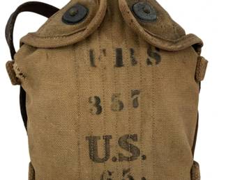 689 - U.S. 65 FRS Military Canteen w/ Canvas Cover (Description): U.S. military canteen marked "FRS 357 U.S. 65" on the khaki canvas cover. The canteen features a metal cap, dual snap-button closure flaps, and a leather carrying strap. The quilted canvas cover shows authentic period wear consistent with World War II era field equipment. Measures 8 1/2" x 6" x 3".