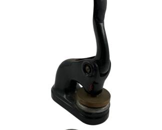 715 - National Seal Works Cast Iron Seal Embosser (Description): National Seal Works cast iron seal embosser. This vintage embossing press features a lever-action handle and produces a raised seal impression. Measures 7 inches tall by 4 inches wide by 1.5 inches deep.