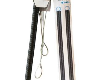 392 - 2 140lb Extension Springs 27.5" (Description): Two 140lb extension springs measuring 27.5 inches in length. These heavy-duty springs are designed for use in garage door systems or similar applications requiring reliable tension support.