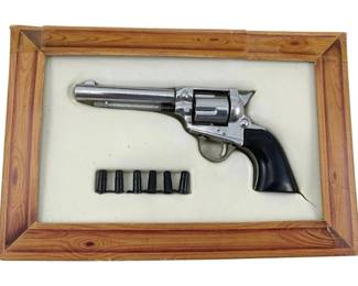 642 - Hubley No 236 Toy Gun w/Box 7"x2" (Description): Hubley Toy Gun No 236 with original box. This vintage toy revolver features a chrome-finished body with black plastic grips. The set includes the toy gun and accompanying bullets. Measures 7" x 2".