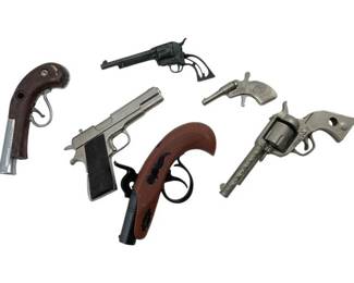 656 - Group Lot of Toy Guns (Description): Group lot of toy guns including various styles and designs. Largest measures approximately 4 inches.