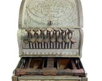 262 - Antique National Cash Register 17"x10"x15" (Description): Antique National cash register featuring ornate embossed metalwork and original keys. Missing marble top over wooden cash compartments. Measures 17 inches wide by 10 inches deep by 15 inches tall. Used as is electric/electronic/mechanical item. No guarantee all components, untested.