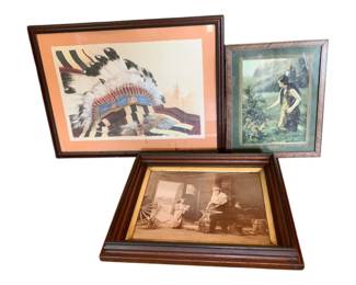 34 - Group Lot of 3 Framed Prints 18"x24" (Description): Group lot of three framed prints. The collection includes a Native American headdress print with coral matting in a dark wood frame, a scenic print depicting a Native American figure in a landscape with green matting, and a sepia-toned photograph orprint showing a blacksmith scene in an antique walnut frame with gold inner border. Largest measures 18" x 24".