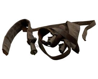 22 - Cavalry Bandolier Shot Carrier 18" (Description): Cavalry bandolier shot carrier constructed of dark brown leather. This military accessory features multiple cylindrical shot holders attached to leather straps designed to be worn across the body. The leather shows significant age and patina consistent with period use. Measures 18 inches.