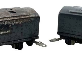 261 - Pair of Lionel Train Cars 3"x3"x8" (Description): A pair of Lionel train cars. Each car measures 3 inches by 3 inches by 8 inches.