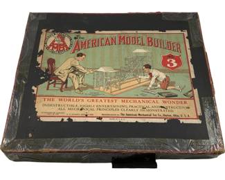 1096 - Vtg American Model Builder No. 3 Set in Box (Description): American Model Builder Set No. 3 in original box. Manufactured by The American Mechanical Toy Co., Dayton, Ohio, U.S.A. The box features colorful lithographed artwork depicting children constructing mechanical models, with the tag line "The World's Greatest Mechanical Wonder." Patented in Canada July 29, 1913. The box shows age-appropriate wear with some edge wear and surface scuffing consistent with its vintage