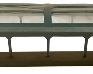 242 - Marklin HO 424 Train Station Platform (Description): This model railroad accessory features a covered platform design typical of Marklin's HO scale train accessories. Measures 5 inches by 12 inches by 16 inches.