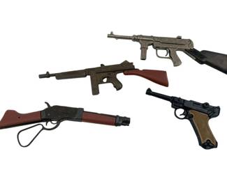 641 - Group of 4 Toy Guns 6.25" (Description): Group of four toy guns. The collection includes miniature replicas of various firearm styles including pistols and rifles. Largest measures 6.25 inches.