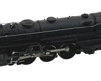 892 - Lionel #5342 Locomotive HO Scale 2"x9"x1" (Description): Lionel #5342 locomotive in HO scale. This die-cast model features a classic black finish with silver mechanical detailing on the wheels and undercarriage. The cab is numbered 5342 and includes window openings for added realism. Measures 2 inches high by 9 inches long by 1 inch wide.