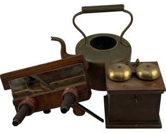 1092 - 3pc Lot Antique Items (Description): A three-piece lot of antique items including a brass kettle with swing handle and wooden grip, a wooden telephone ringer box with dual brass bells, and a wooden diestock tool with turned wooden handles and brass fittings. All pieces display age-appropriate patina consistent with their antique origins.