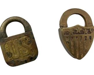 681 - Group of 2 Padlocks w/o Keys 2"x1.5" (Description): Group of two padlocks without keys. One features a raised 'US' design on the front, while the other displays an American flag motif with stars and stripes. Both are brass construction with aged patina. Measures 2" x 1.5".