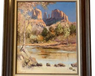 166 - Red Rock Crossing Oil on Board Landscape (Description): Oil on board painting titled "Red Rock Crossing" depicting a scenic Southwestern landscape with iconic red rock formations rising against a blue sky. The composition features a tranquil creek in the foreground with reflective waters, surrounded by desert vegetation and trees with autumn foliage. The painting is signed in the lower left corner and presented in a substantial dark wood frame with gold accents and a linen liner,