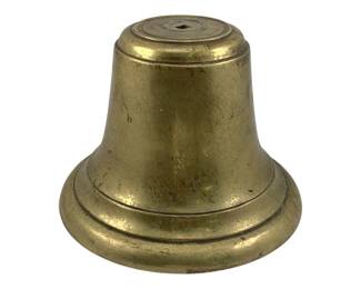 901 - Brass Bell 6"x5" (Description): A solid brass bell measuring 6 inches by 5 inches. The bell features a classic flared shape with decorative incised rings around the base and a flat top with a central mounting hole. The brass shows an aged patina with natural wear consistent with use over time.