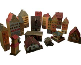 316 - Group Lot of Faller Train Display Houses 8" (Description): Group lot of Faller train display houses, featuring an assortment of European-style miniature buildings ideal for model train layouts. The collection includes multi-story townhouses, half-timbered cottages, commercial buildings, and residential structures, all painted in traditional colors with detailed architectural features. Tallest measures 8 inches.