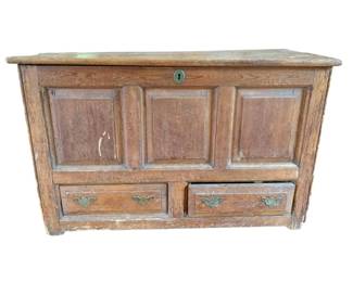 37 - Ant. Oak Paneled Lift Top Chest w/ 2 Drawers (Description): Antique oak lift top chest featuring a three-panel front design with two drawers below. The chest is fitted with brass butterfly bail pulls and an escutcheon keyhole on the top. The piece shows a warm patina consistent with age and use. Measures 25.5" x 40.5" x 17.5".