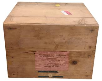 1006 - Marklin Wood Shipping Crate 17"x16"x11" (Description): Marklin wood shipping crate featuring original multilingual instruction labels in German, French, and English regarding proper handling and engine removal. The crate retains its original construction with visible hardware and aged patina. Measures 17 inches by 16 inches by 11 inches.