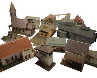 383 - Group Lot of Model Train Display Houses (Description): Group lot of model train display houses. This collection includes various miniature buildings suitable for model train layouts and displays.