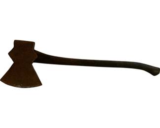 1168 - Antique Axe 31"x10"x8.5" (Description): Antique axe featuring a hand-forged iron head with a distinctive flared cutting edge and curved wooden handle. The head shows a rich rust patina consistent with age, while the dark wooden handle displays a graceful curve ending in a shaped grip. Measures 31" x 10" x 8.5".