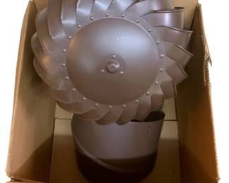 1016 - Metal Turbine Chimney Cap w/ Box (Description): Metal turbine chimney cap with original box. This rotating ventilation cap features a turbine design with multiple curved blades arranged in a spiral pattern to facilitate airflow and prevent downdrafts. Includes original cardboard storage box.