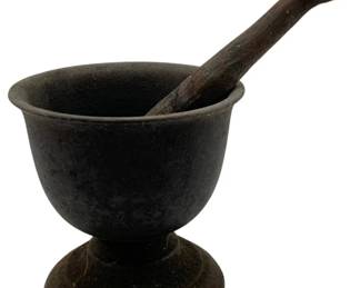 1018 - Cast Iron Mortar & Pestle 8"x5" (Description): Cast iron mortar and pestle set. The mortar features a footed base design. Measures 8 inches by 5 inches.