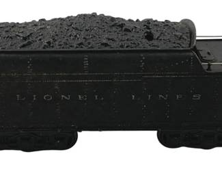 889 - Lionel Lines O Scale Coal Tender Car (Description): Lionel Lines O scale coal tender car in black finish. The tender features a simulated coal load on top and is marked "Lionel Lines" on the side. Complete with metal handrails and couplers. Measures 4" x 9.5" x 2.5".