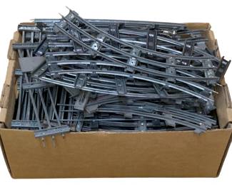 987 - Box Lot O-Scale Train Tracks (Description): A box lot of O-scale train tracks. This assortment includes various track sections suitable for model railroad layouts.
