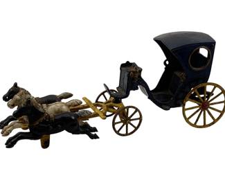 984 - Antique Metal Horse & Buggy 5.5"x16"x4" (Description): Antique metal horse and buggy toy featuring a pair of horses pulling a carriage. The piece measures 5 1/2 inches by 16 inches by 4 inches.