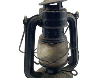 623 - Globe Brand No. 202 Lantern (Description): Globe Brand lantern, No. 202, made in Hong Kong. This vintage-style kerosene lantern features a classic design with a glass globe and metal frame. Measures 9" x 5" x 3.5".