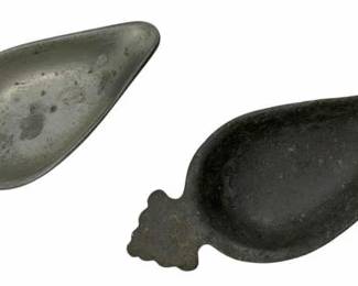 134 - Set of 2 Ant. Pewter Pap Boats 5"x2" (Description): A set of two antique pewter pap boats, each measuring 5 inches by 2 inches. These traditional infant feeding vessels feature a characteristic teardrop-shaped bowl with a decorative scalloped handle at the narrow end. One boat displays a lighter silvery pewter patina while the other has developed a darker oxidized finish, showing the natural aging of the metal over time.