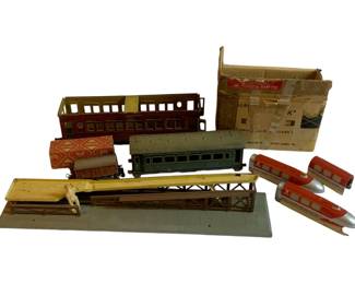 1049 - Lot Assorted Train Items (Description): A lot of assorted train items including various vintage toy trains, train cars, and related accessories.