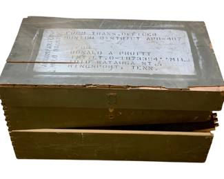 1064 - Wood Box - AS IS/Damaged 15.5"x29"x14.5" (Description): Wooden box in as-is condition with damage. The piece features a military green painted finish with shipping label visible on the top surface. Measures 15.5 inches by 29 inches by 14.5 inches.