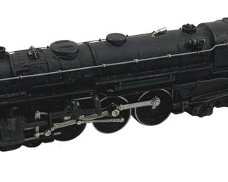 893 - Lionel #5342 Locomotive HO Scale 2"x9"x1" (Description): Lionel #5342 locomotive in HO scale. This black steam engine model features detailed components including connecting rods, drive wheels, and cab with windows. The number 5342 is visible on the cab side. Measures 2 inches high by 9 inches long by 1 inch wide.