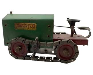 1 - Structo Toys Wind Up Tractor 3"x8.25"x4" (Description): Structo Toys wind up tractor measuring 3" x 8.25" x 4". This vintage pressed steel toy features a green engine compartment with the original Structo Toys decal, a red operator's platform with steering wheel and seat, and metal caterpillar tracks with red wheel hubs. The wind-up mechanism powers the treads for motion.
