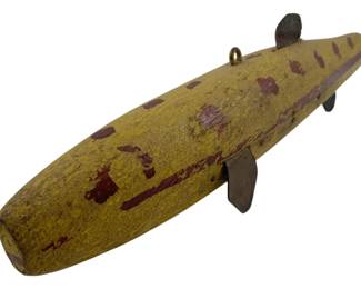 679 - Vtg Wooden Ice Fishing Spear Decoy (Description): Vintage wooden ice fishing spear decoy featuring painted decoration and metal fins. Measures 3 inches by 12 inches by 2 inches.