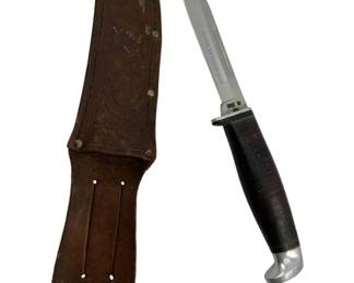 710 - Case XX USA Knife w/ Sheath 9" (Description): Case XX USA knife with leather sheath. The knife features a stacked leather handle with aluminum pommel and guard. Measures 9 inches overall.