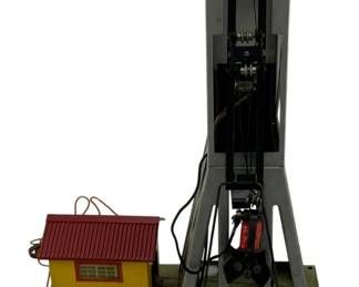 1020 - American Flyer Crane Grain Loader 16"x11"x5" (Description): American Flyer Crane Grain Loader. This model railroad accessory features a crane mechanism with an attached small house structure. Measures 16" x 11" x 5".