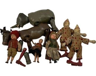 1095 - Lot Antique Toys incl Dolls Clowns & Animals (Description): A charming collection of antique toys including composition and cloth dolls, two clown figures in polka dot costumes, jointed wooden animal figures including an elephant and horse, and various doll parts. The lot displays characteristic wear consistent with age and play, featuring hand-painted details and period fabric clothing on several pieces.