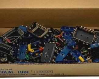 878 - Box Lot Assorted Wire Connectors (Description): A box lot of assorted wire connectors in various colors including black, blue, and metallic finishes. The collection includes multiple styles of connectors with different colored pins and attachments. Sold as a lot.