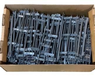 986 - Box Lot O-Scale Train Tracks (Description): A box lot of O-scale train tracks. This collection includes numerous track sections suitable for O-gauge model railroad layouts.