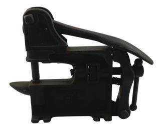 905 - Antique Panama Riveting Tool 7.5"x8"x2" (Description): Antique Panama riveting tool constructed of cast iron with a black finish. This bench-mounted hand tool features a lever-operated mechanism for setting rivets, with an adjustable clamp screw for securing to a work surface. The body is marked with the Panama name and patent information. Measures 7.5" x 8" x 2".