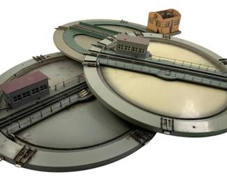 361 - Vtg Group of 3 Marklin Motorized Turntables (Description): Vintage group of three Marklin motorized train turntables. Each turntable features track sections and miniature building structures. Measures 2 inches by 15 inches.