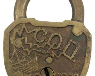 649 - Simmons Wireless Padlock w/o Key 2.75"x2" (Description): Simmons Wireless padlock without key. The lock features decorative engraved patterns on its face and shows an aged brass patina. Measures 2 3/4" x 2".