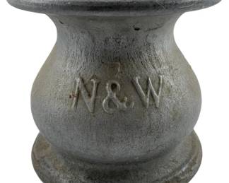 671 - Norfolk & Western Railway Aluminum Spittoon (Description): Norfolk & Western Railway cast aluminum spittoon featuring the raised N&W railroad marking. Measures 6.5 inches by 7.25 inches.
