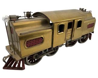 741 - Lionel Prewar Standard Gauge 54 Brass Loco (Description): Lionel Prewar Standard Gauge 54 Electric Brass Locomotive. This classic model train features the distinctive brass body construction characteristic of early Lionel production. Measures 6 inches high by 11.25 inches long by 4.5 inches wide.