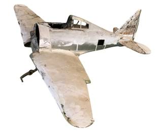 1106 - Vtg Metal Model Airplane #3 9"x2.25"x3.625" (Description): Vintage metal model airplane marked #3 on the tail. This handcrafted propeller aircraft features a weathered painted finish in cream and gray tones with an open cockpit design. The plane shows authentic aging and patina throughout. Measures 9 inches long by 2.25 inches wide by 3 5/8 inches high.