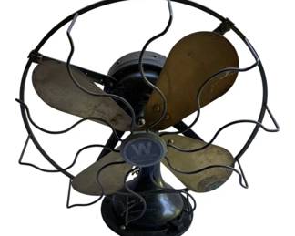 698 - Westinghouse Fan w/o Cord 11"x10"x13" (Description): Vintage Westinghouse electric fan without cord. Features four brass blades and a wire cage guard with the distinctive Westinghouse logo badge on the front. Black painted metal body with classic oscillating desk fan design. Measures 11 inches by 10 inches by 13 inches. Used as is electric/electronic/mechanical item. No guarantee all components, untested.