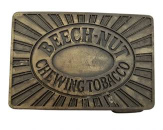 375 - Beech-Nut Chewing Tobacco Metal Belt Buckle (Description): Beech-Nut Chewing Tobacco metal belt buckle featuring the brand's classic logo design. Measures 2" x 2.75".