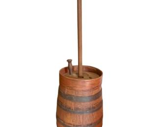 32 - Antique Wood & Metal Barrel Butter Churn (Description): Antique wooden barrel-style butter churn with metal band reinforcements. This traditional churn features a stave-constructed barrel body secured with four metal bands, a fitted wooden lid with central hole, and a tall wooden dasher handle. The churnretains its warm aged wood patina. Measures 46 inches tall by 11 inches in diameter.